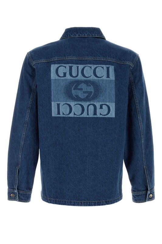 Blue denim jacket with Gucci logo on a white background