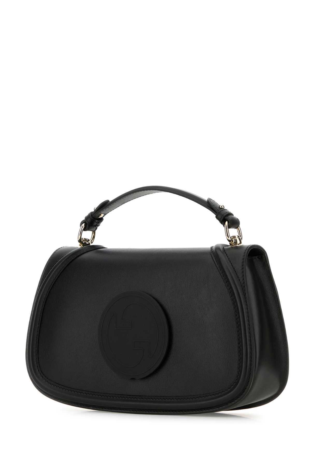 Black handbag with a circular design on a white background