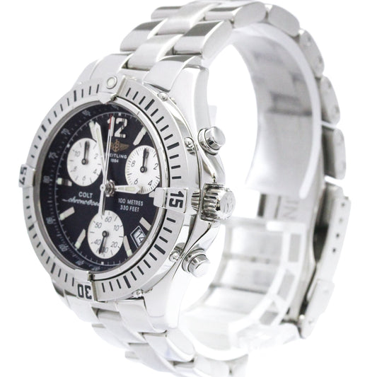 A silver stainless steel Colortone wristwatch with a black dial, featuring three white sub-dials, a rotating bezel, and a matching silver metal link bracelet.