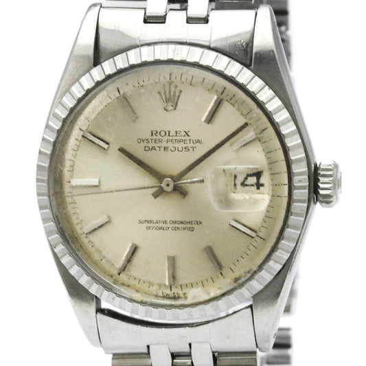 Silver Rolex watch with a beige dial on a white background