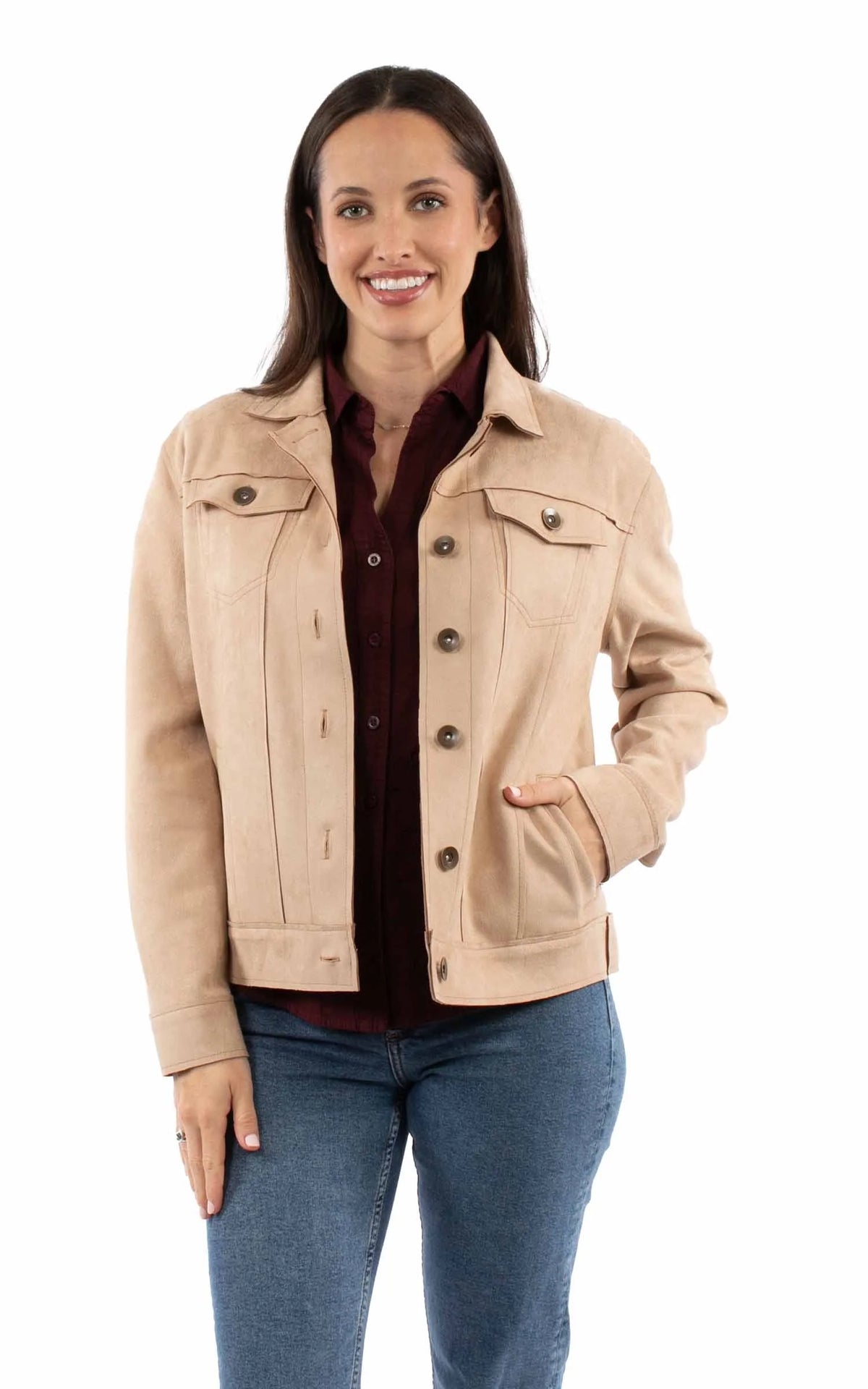 Woman wearing a beige jacket over a red shirt on a white background