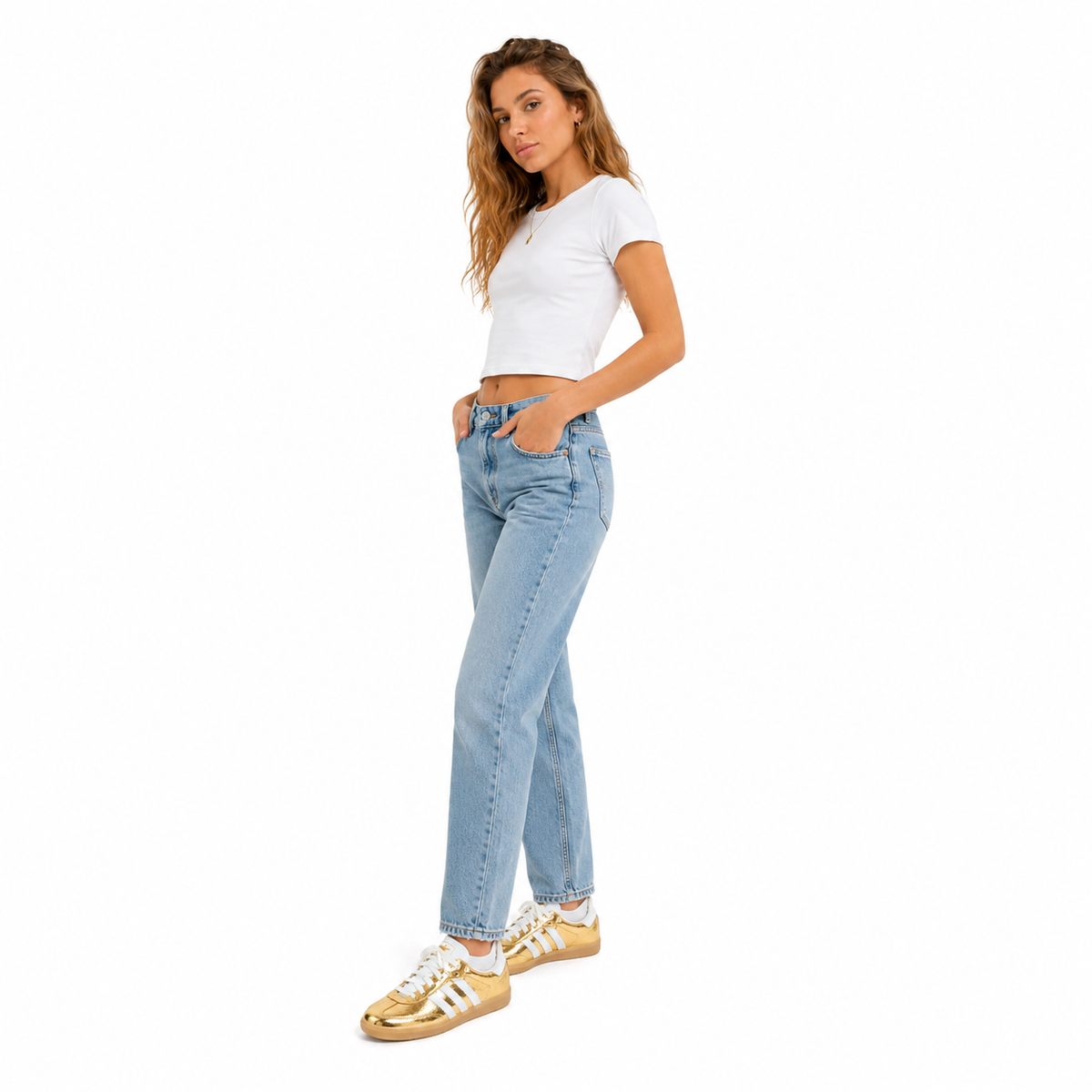 Woman wearing light blue jeans and a white top on a white background