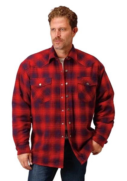 Man wearing a red and blue plaid shirt on a white background