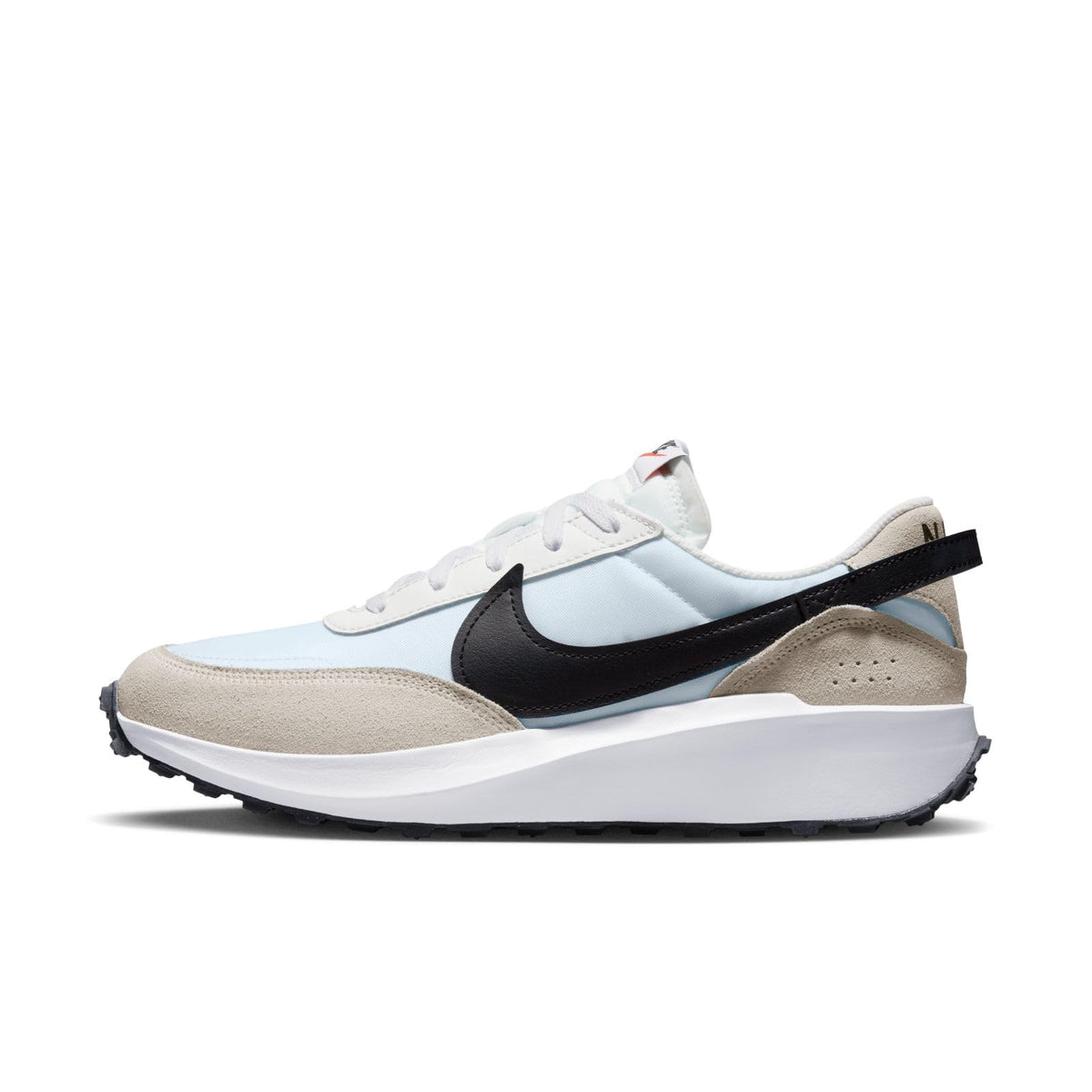 A Nike sneaker in light blue, beige, white, and black, shown from a side profile on a clean white background.