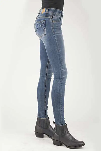 Blue jeans worn by a person on a white background