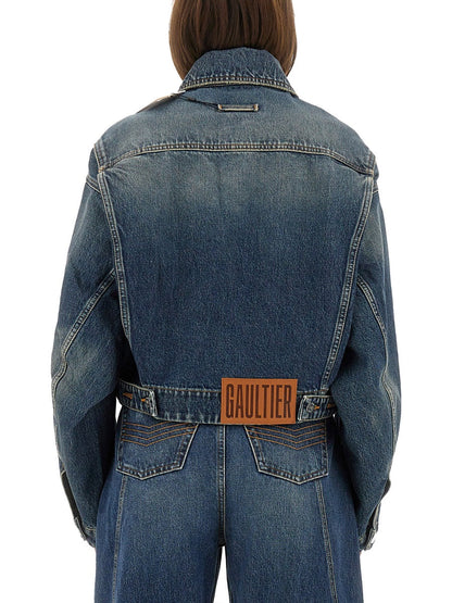 Blue denim jacket with a visible brand logo on a white background