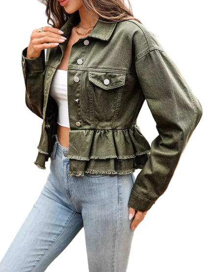 Person wearing an olive green peplum jacket and light blue jeans outdoors.