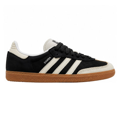 A classic Adidas Samba sneaker in black suede with off-white stripes, a black laces, and a brown gum sole, shown from a side profile on a white background.