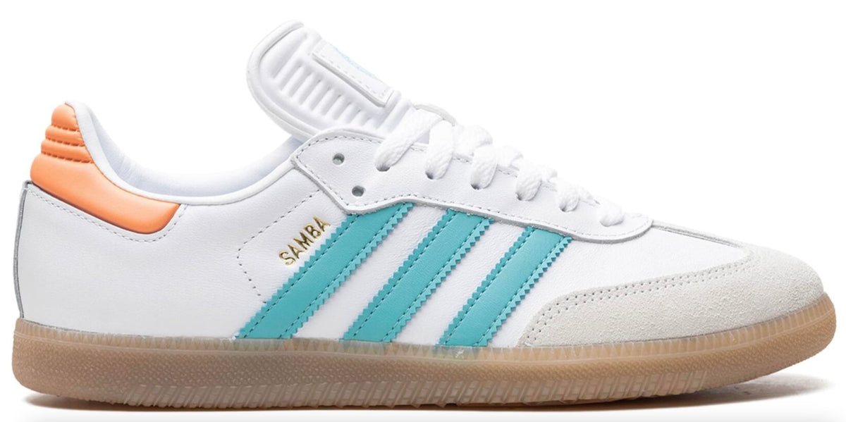 White sneaker with blue stripes and orange accents on a white background