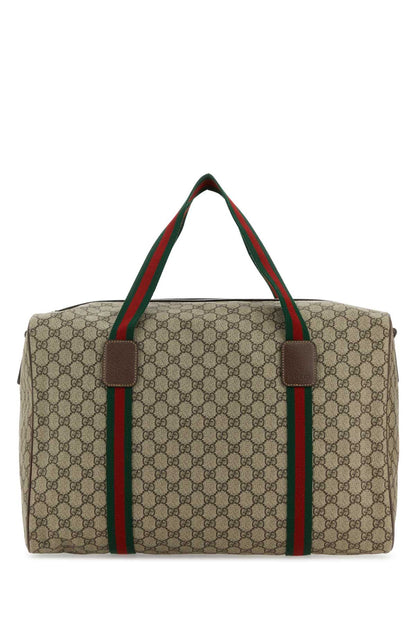 Gucci GG Supreme canvas duffel bag with brown leather trim and the signature green and red web stripe on the handles, shown against a plain white background.
