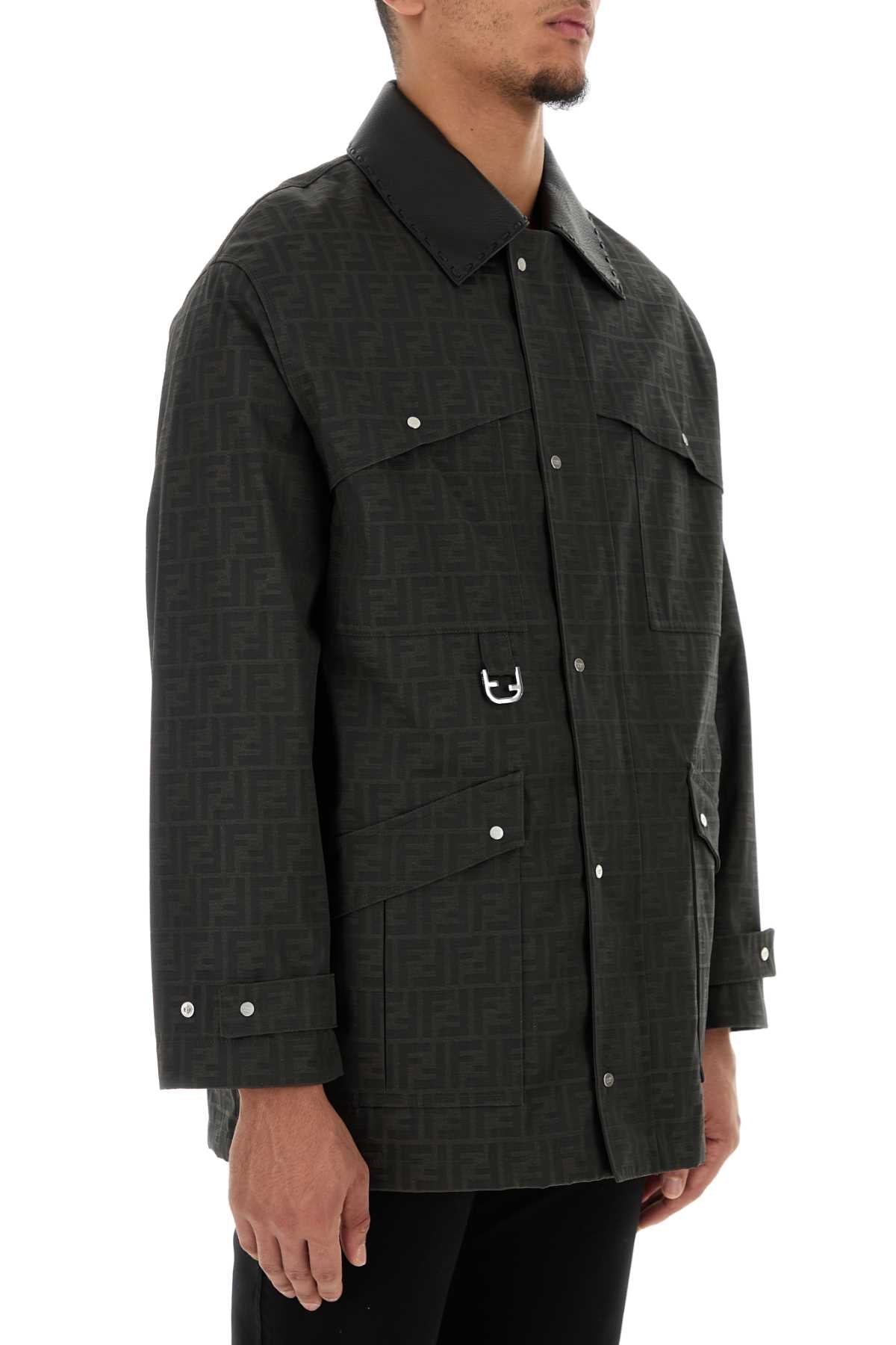 Man wearing a dark textured jacket on a white background