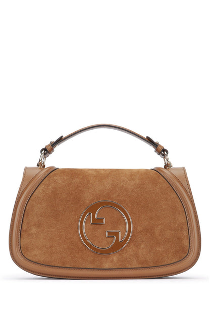 Brown handbag with a prominent logo on a white background