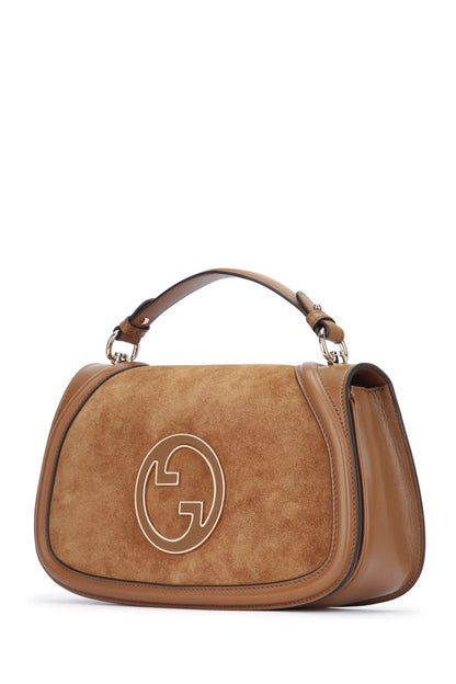 Brown handbag with a logo on a white background
