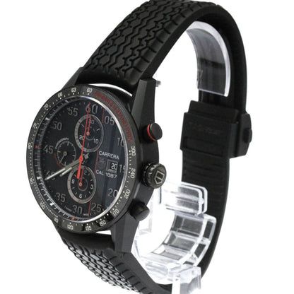 Black wristwatch with detailed face on a white background