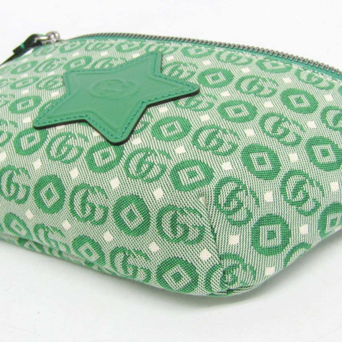 Green patterned pouch with a star-shaped tag on a white background