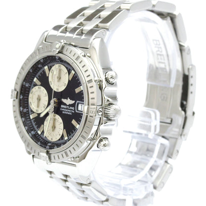 A Breitling Super Marine chronograph watch with a silver stainless steel case and link bracelet, featuring a black dial with three cream-colored subdials.