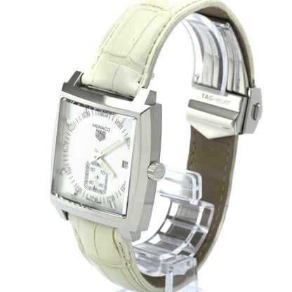 Watch with a white strap on a clear stand against a white background