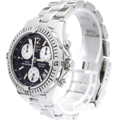 A silver stainless steel Colortone wristwatch with a black dial, featuring three white sub-dials, a rotating bezel, and a matching silver metal link bracelet.