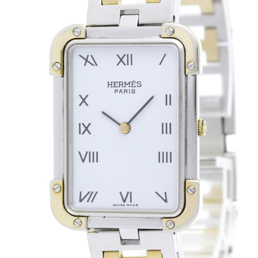 Hermes Paris two-tone stainless steel and gold watch with a white dial and Roman numeral markers.