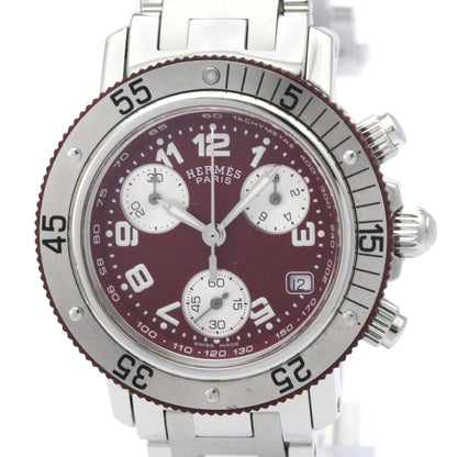 Hermes Paris stainless steel chronograph watch with a deep burgundy dial, silver-tone bezel, and white sub-dials.