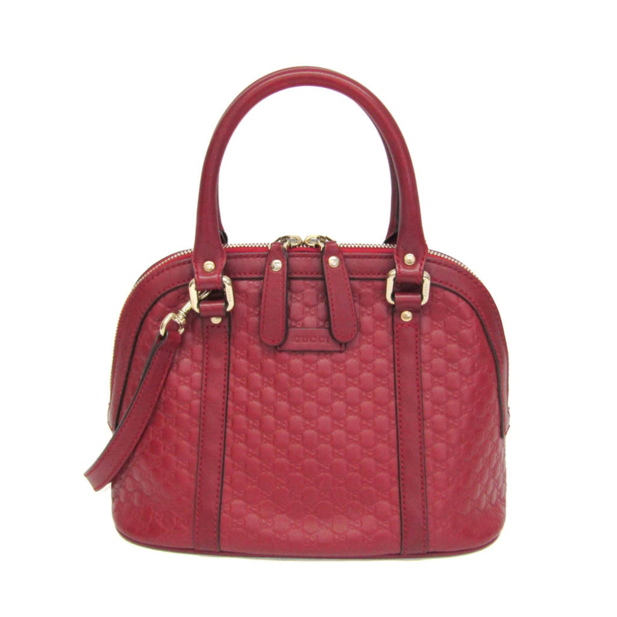 Red handbag with gold accents on a white background