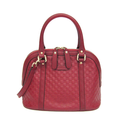 Red handbag with gold accents on a white background