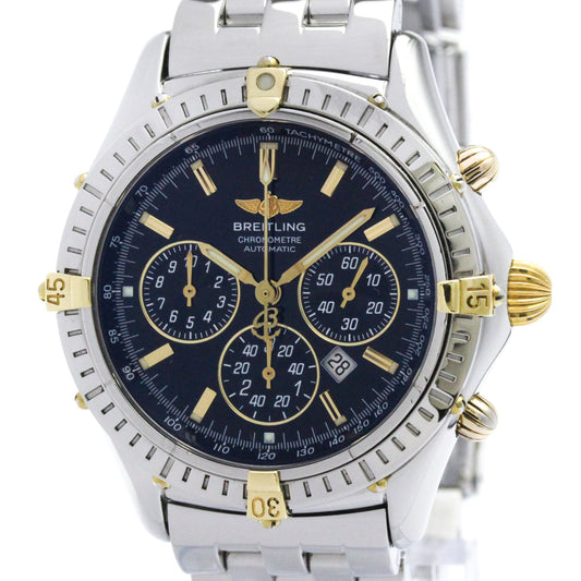 A Breitling Chrono Daytona Automatic watch with a silver stainless steel bracelet, a dark blue dial, and gold-tone accents, shown on a white background.