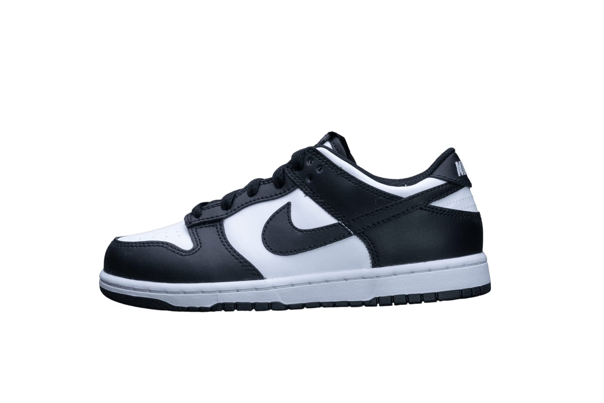A Nike Dunk sneaker in black and white, shown from the side profile against a solid white background.