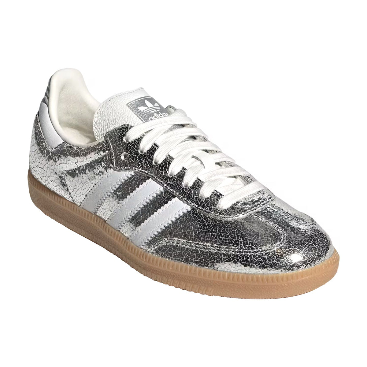 A silver metallic Adidas Samba sneaker with a textured leather finish, white laces, and a gum sole, shown on a plain white background.