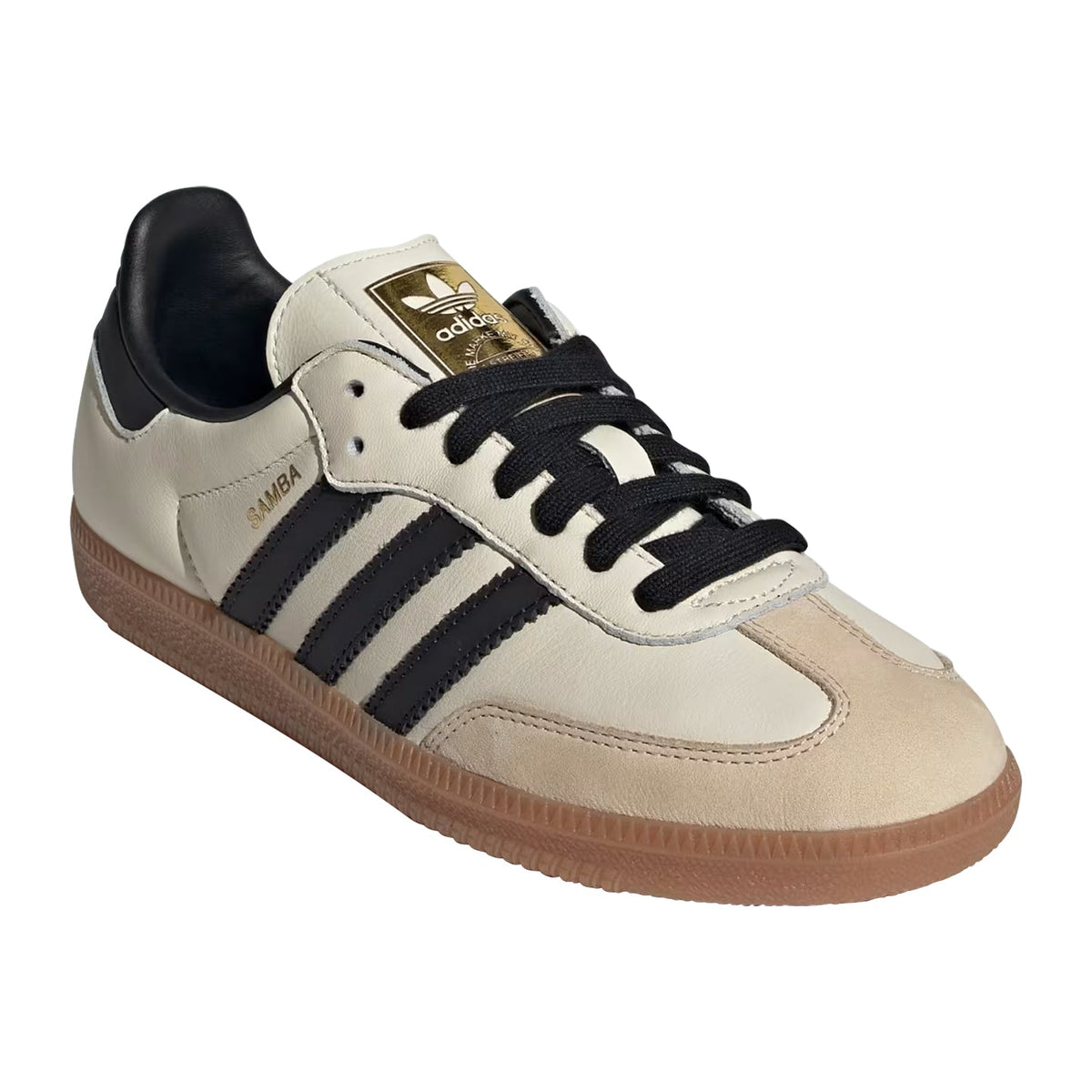 Beige Adidas sneaker with black stripes and brown sole on a white background