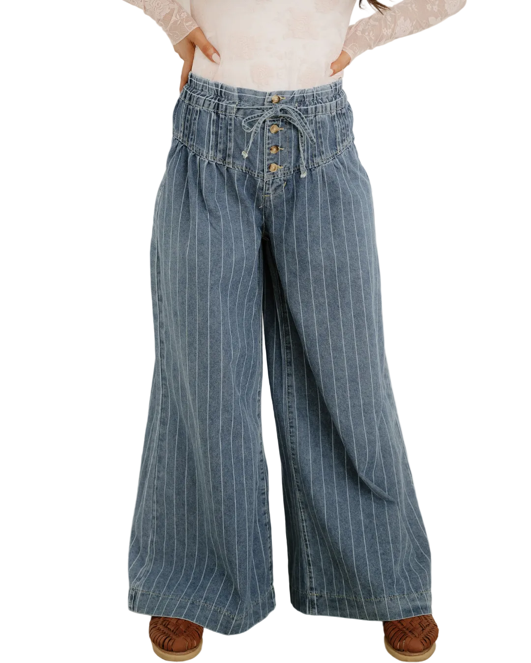 Person wearing blue striped wide-leg jeans against a white background