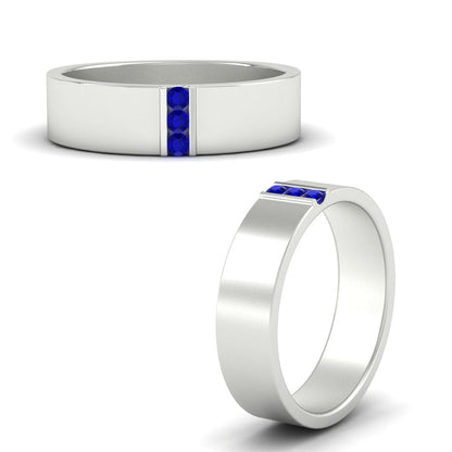 Two silver rings with blue gemstones on a white background