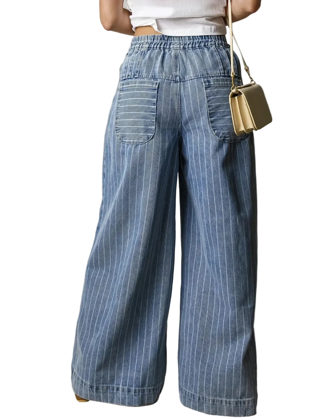 Person wearing blue striped wide-leg pants with a gold handbag on a neutral background