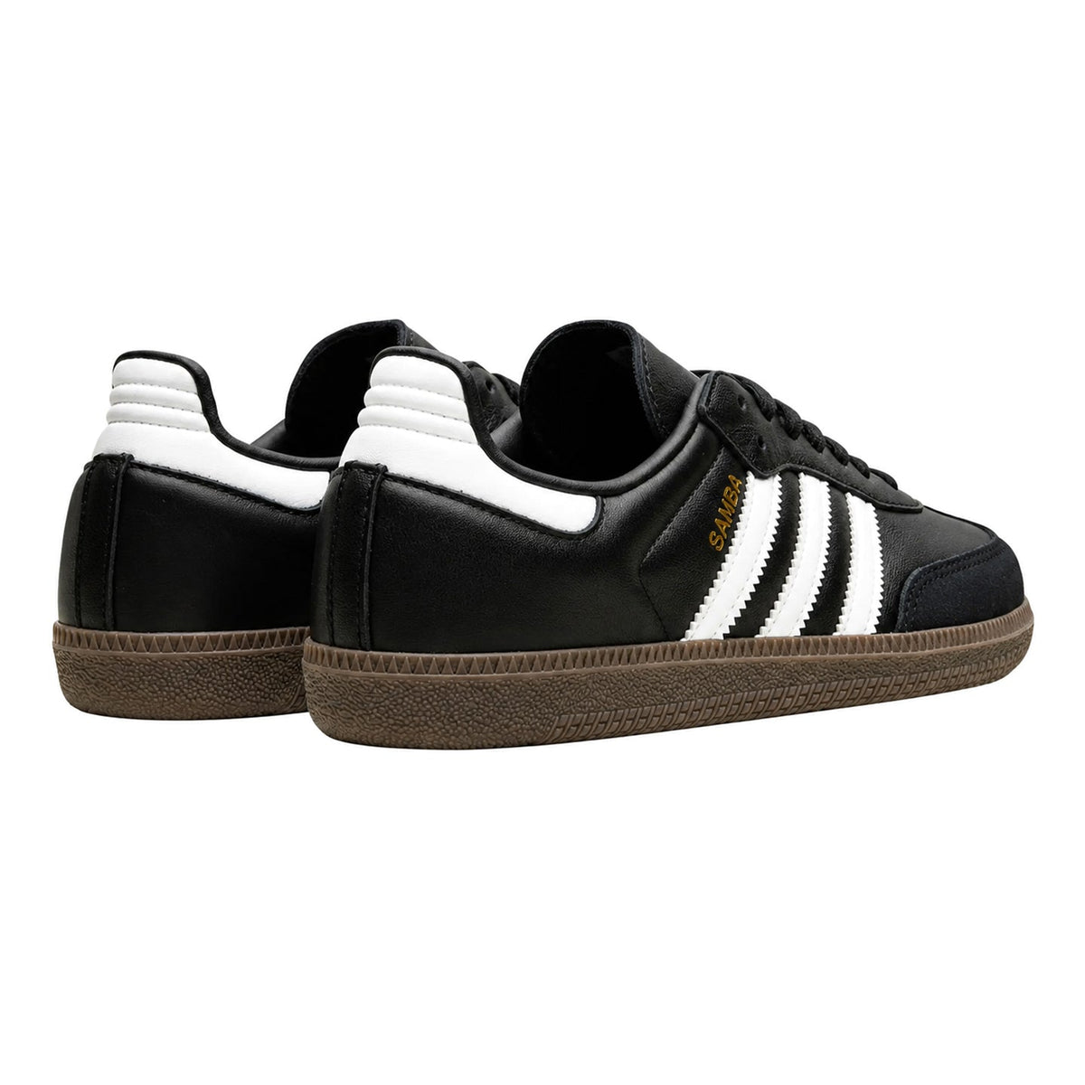 A pair of Adidas Samba sneakers in black leather with white three-stripes, a white heel tab, and a brown gum sole, shown against a plain white background.