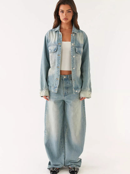 Woman wearing a light blue denim jacket and pants on a white background