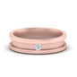 Rose gold ring with a diamond on a white background