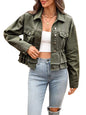 A woman wearing an olive green cropped denim jacket with a ruffled hem, styled over a white tube top and light blue jeans.