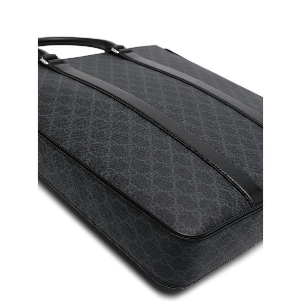 Black patterned suitcase on a white background