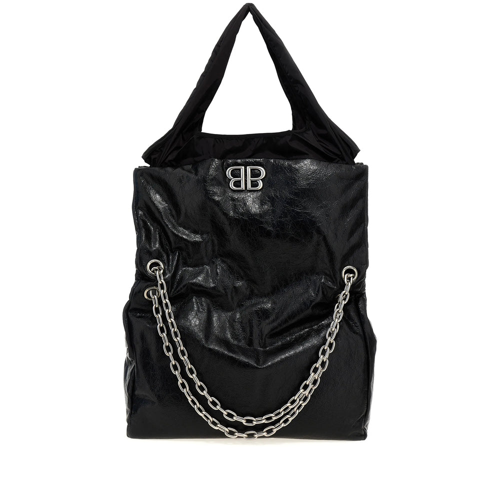Black handbag with chain detail and logo on a white background