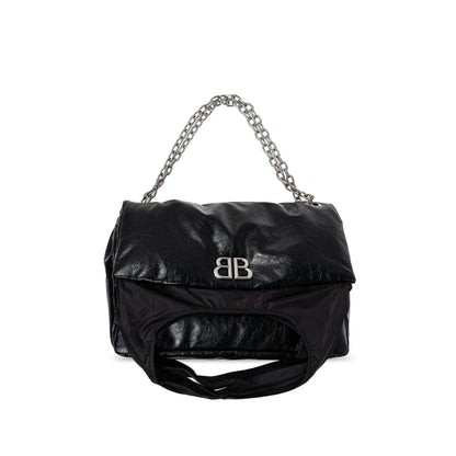 Black handbag with chain handle on a white background