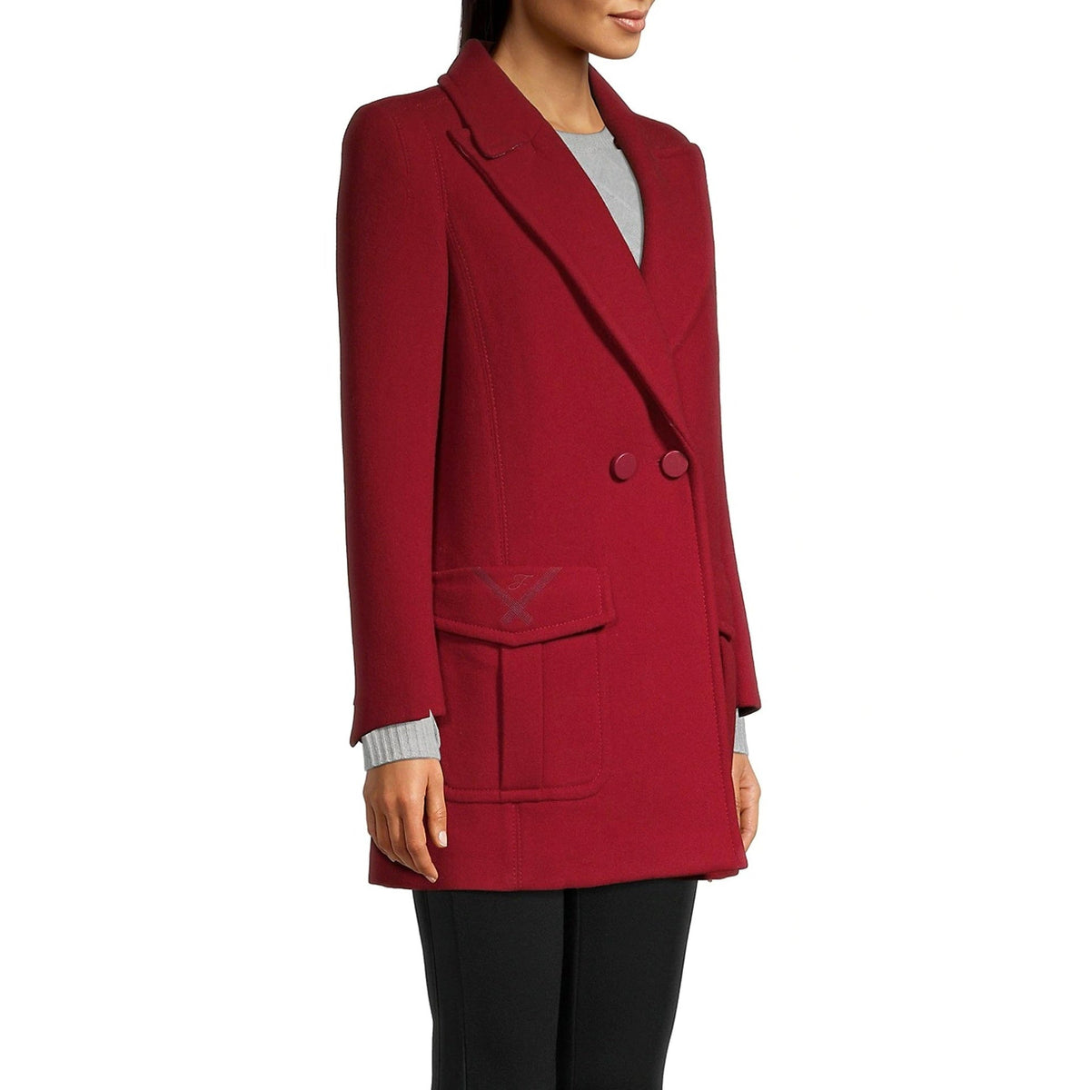 Red coat worn by a person on a white background