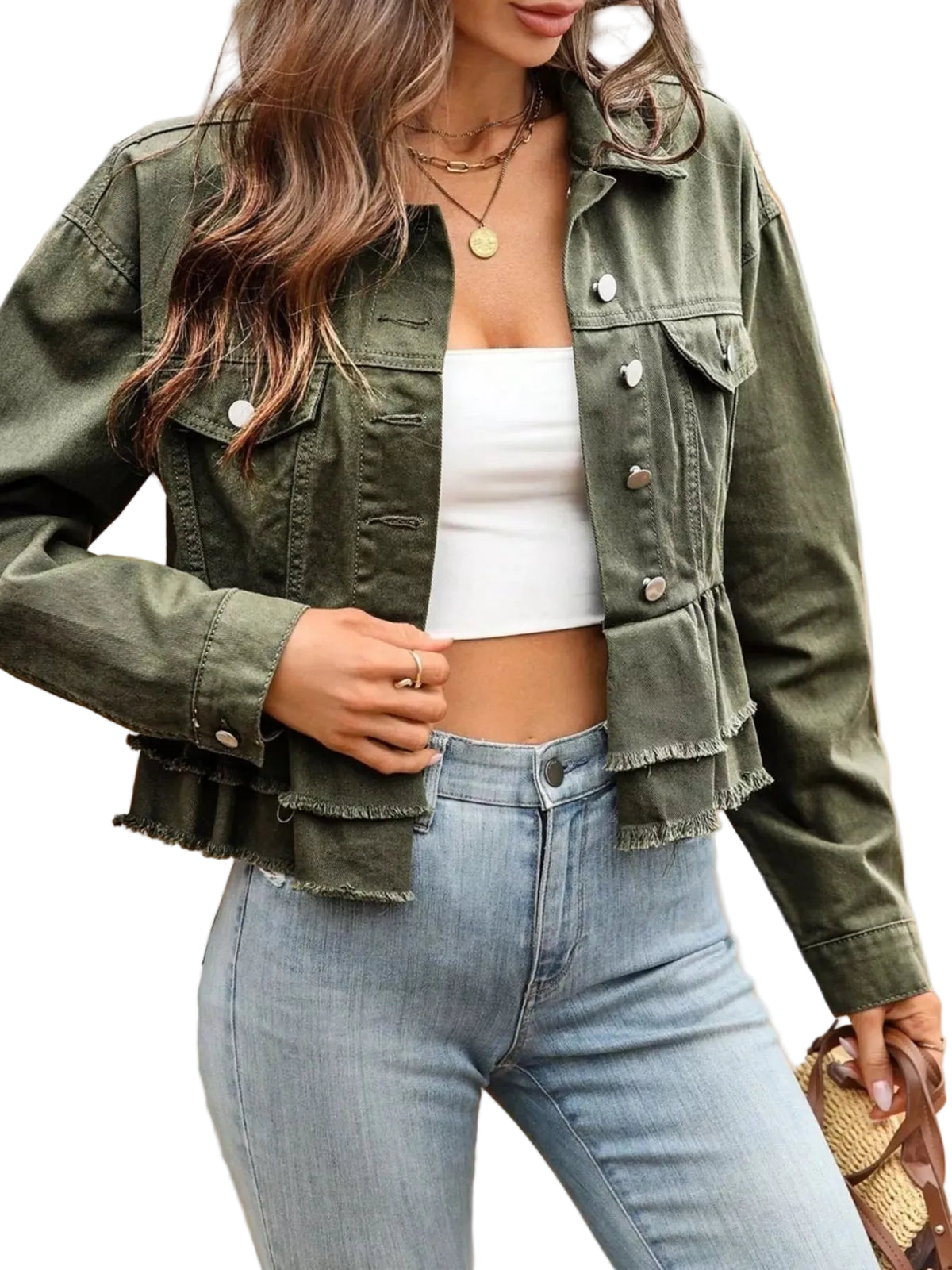 Person wearing a green denim jacket and light blue jeans outdoors.