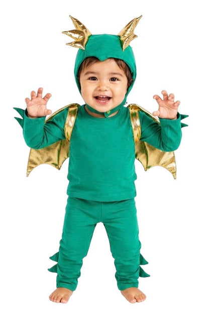 Child wearing a green dinosaur costume with gold accents on a white background