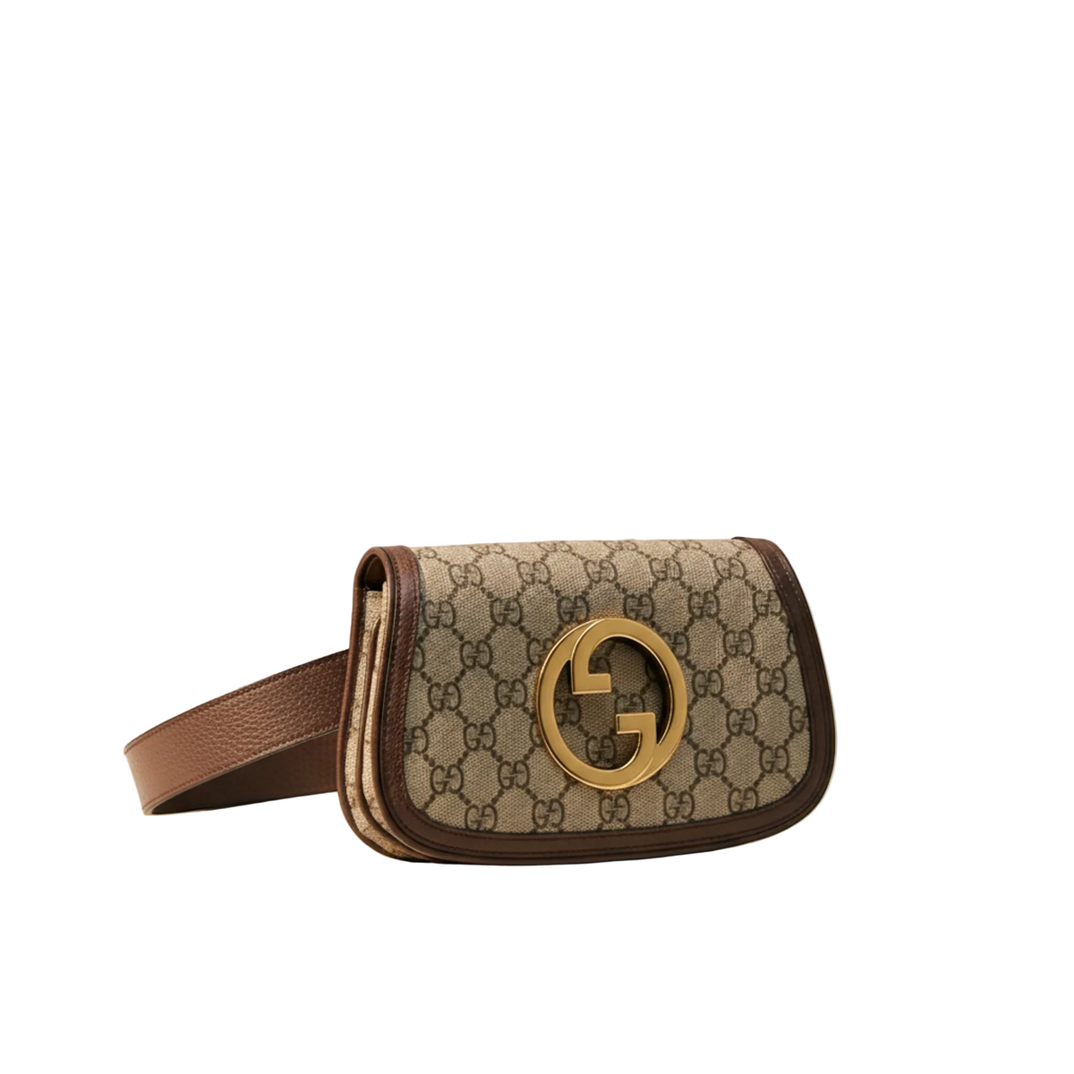 A Gucci shoulder bag in beige GG Supreme canvas with brown leather trim and a large gold-tone interlocking G logo, resting on a white marble surface against a neutral beige background.