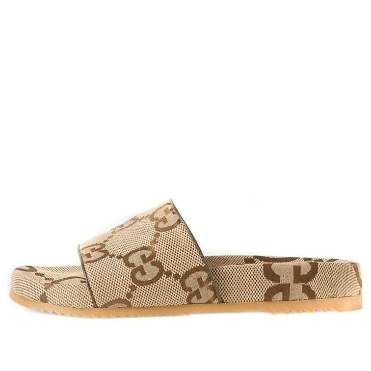 Beige slide sandal with brown pattern on a white background