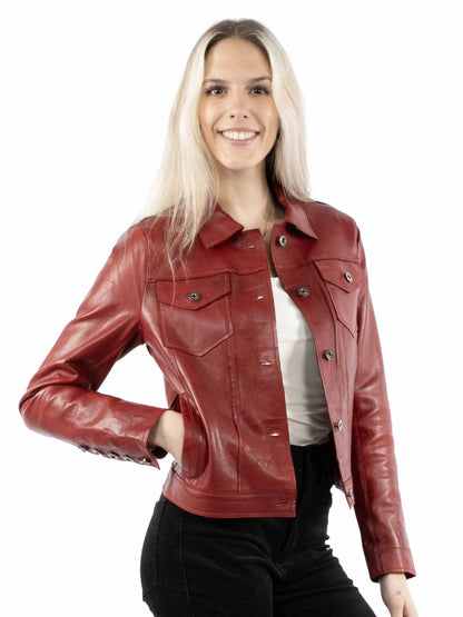 Woman wearing a red leather jacket on a white background