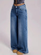 Wide-leg jeans worn by a person on a light gray background