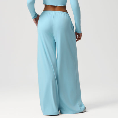 Light blue long-sleeve top and wide-leg pants on a white background