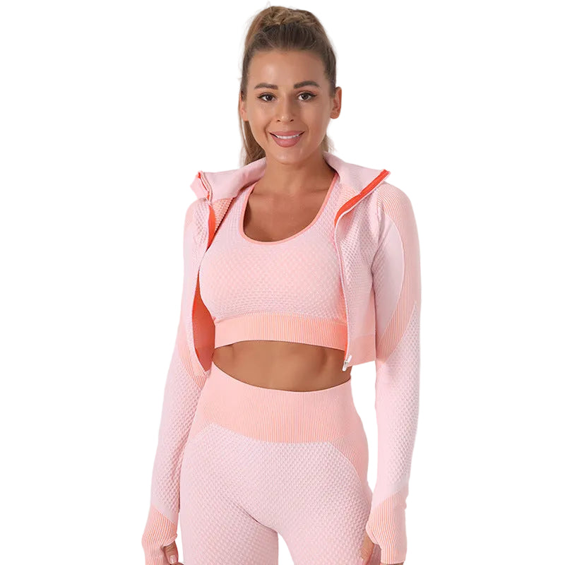 Woman wearing a pink athletic outfit on a light gray background