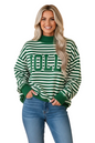 A woman modeling a green and white striped crewneck sweatshirt with 'JOLLY' printed across the chest in green block letters, paired with blue jeans against a solid peach background.